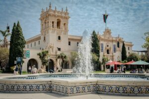 Architecture and grounds in Balboa Park, San Diego. Photo Murali Raju / Unsplash; illustrative county guide cover.