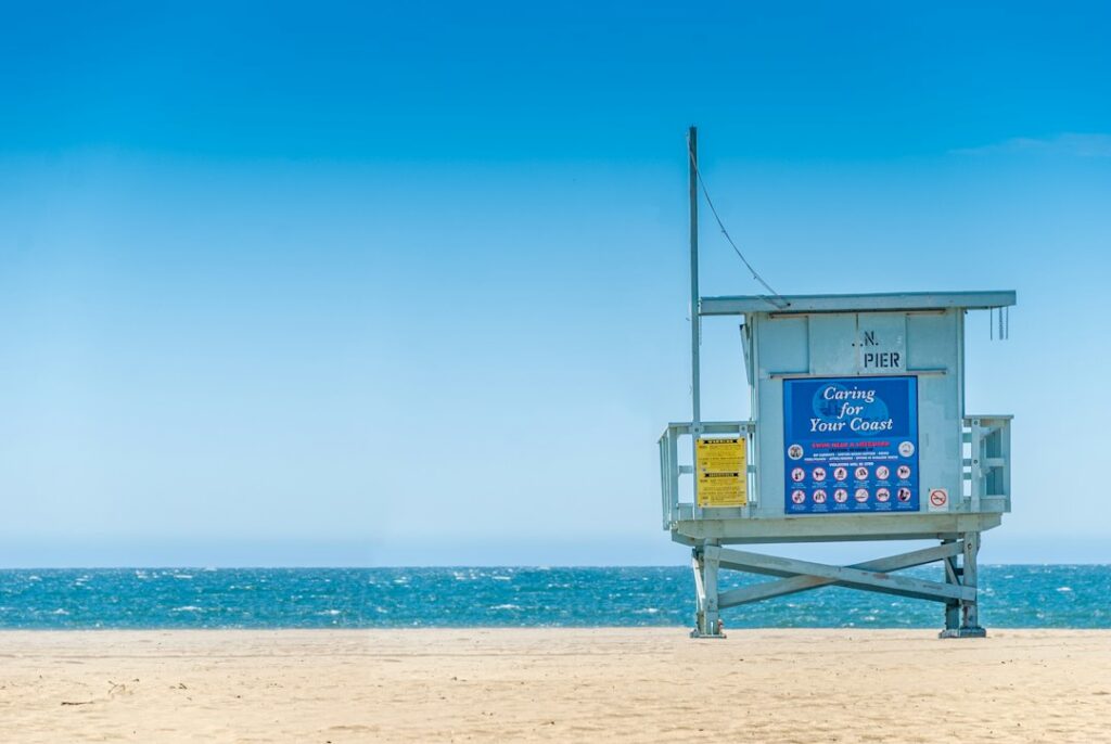 Beach lifeguard tower photo by David Vives / Unsplash; illustration, not the October 2026 tryouts.