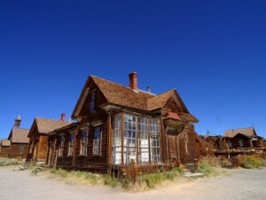 Historic wooden buildings in Bodie State Historic Park, Mono County; archival photograph by Jon Sullivan (2004), public domain.