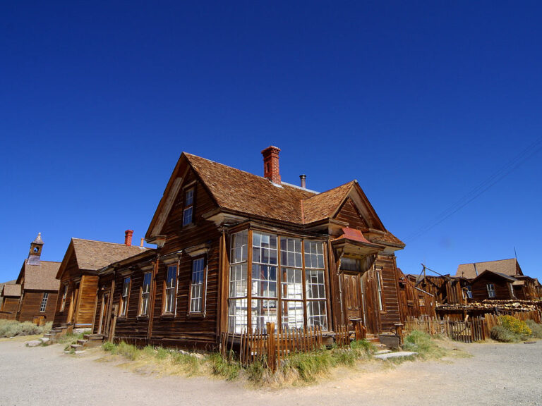 Historic wooden buildings in Bodie State Historic Park, Mono County; archival photograph by Jon Sullivan (2004), public domain.