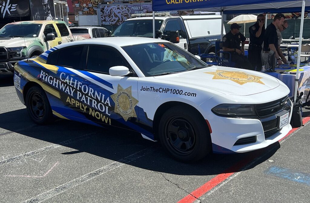 California Highway Patrol recruitment patrol car — archive illustration photographed in 2022 by TaurusEmerald, CC BY-SA 4.0; not the October 2026 CHP graduation ceremony.