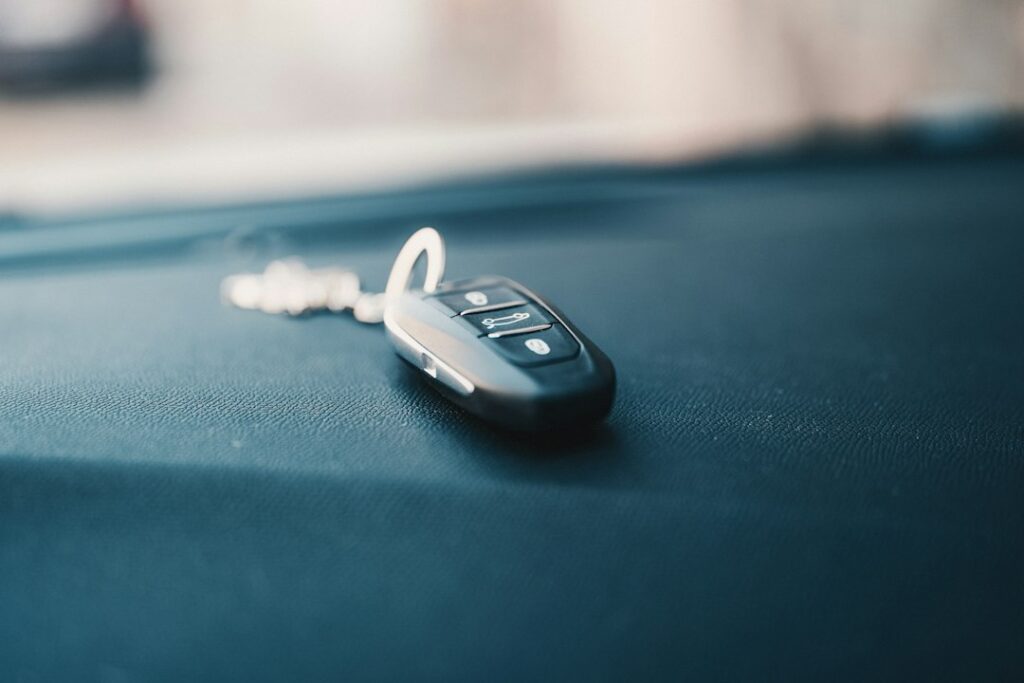 Illustrative car key fob photographed by Bence Balla-Schottner / Unsplash; not a specific LAX SAN SFO rental company or airport.