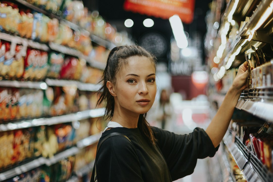 Young adult shopping for groceries, illustrating CalFresh food benefits for California college students