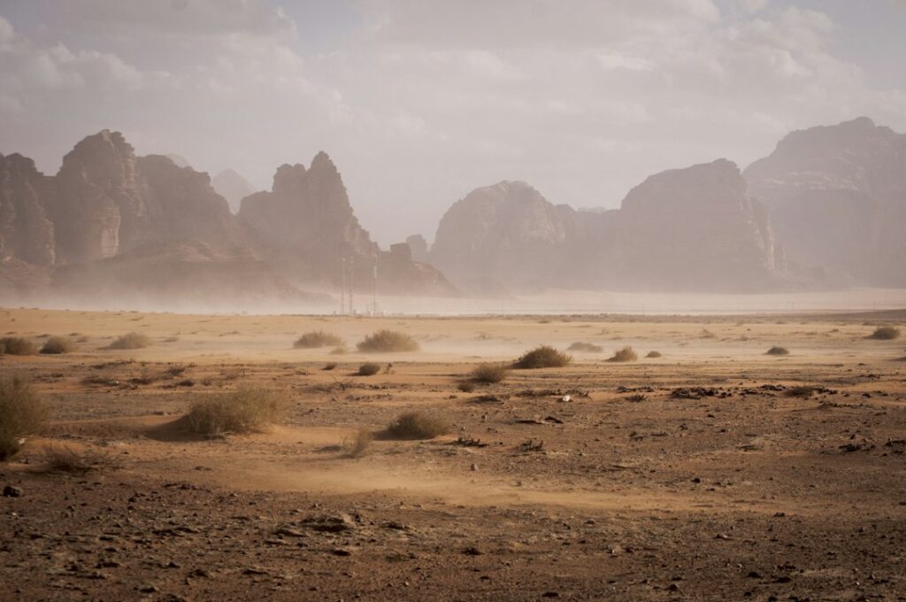 Illustrative desert valley by Juli Kosolapova / Unsplash; not a California parcel surveyed or certified for subdivision compliance.