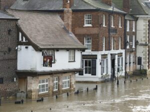 Illustrative 2020 flooding photograph by Don Lodge; not the Seaside sandbag locations or an October 2026 flood.