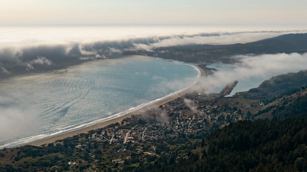 Fog flowing toward Stinson Beach on the Marin County coast; illustrative photo, not a current surf conditions report