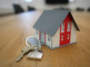 Illustrative house keys and real estate documents; not an image of the Missing Middle LA city proposal.