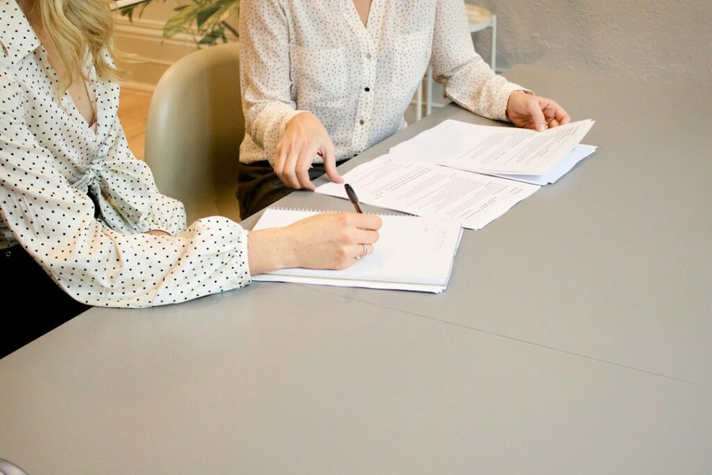Illustrative paperwork and assistance image; not Monterey County social services staff or office