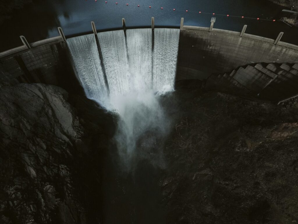 Illustrative flowing water, not the Nacimiento Dam spillway, plunge pool or completed erosion-protection engineering project