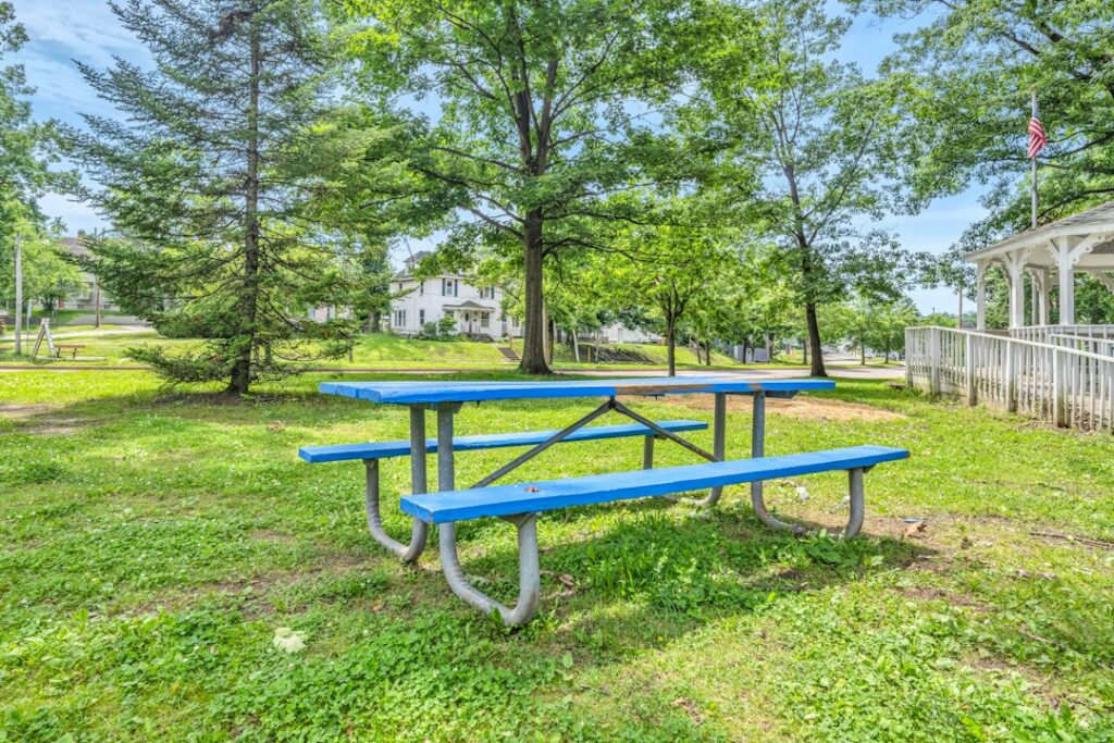 Public park picnic table in tree shade, illustrative only and not a North County Recreation and Park District facility