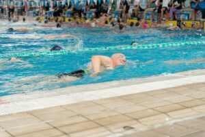 Illustrative swimmer in an indoor pool, not the Pattullo Swim Center in Seaside or the new fall schedule