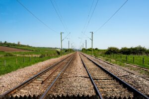 Illustrative railway tracks photograph, not the actual local news site or facility