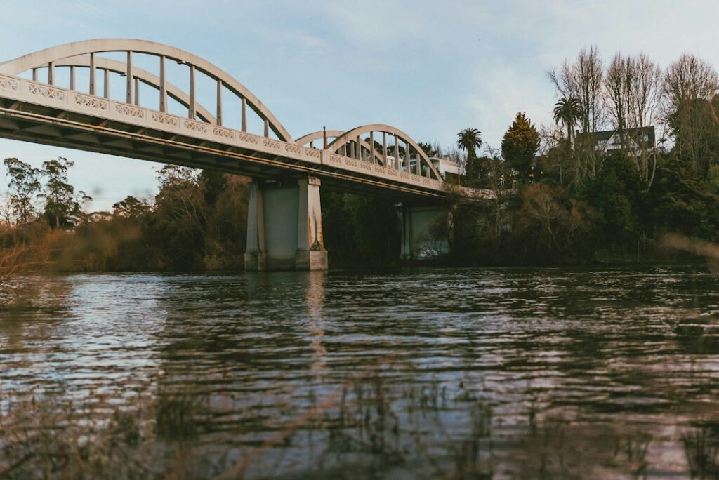 Illustrative river bridge photograph, not Robles del Rio, Carmel River or the 1995 Monterey County floods