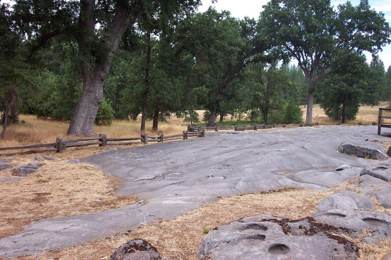 Indian Grinding Rock State Historic Park in California's Sierra Nevada foothills. Historical 2006 photograph by artq55, CC BY-SA 2.0.