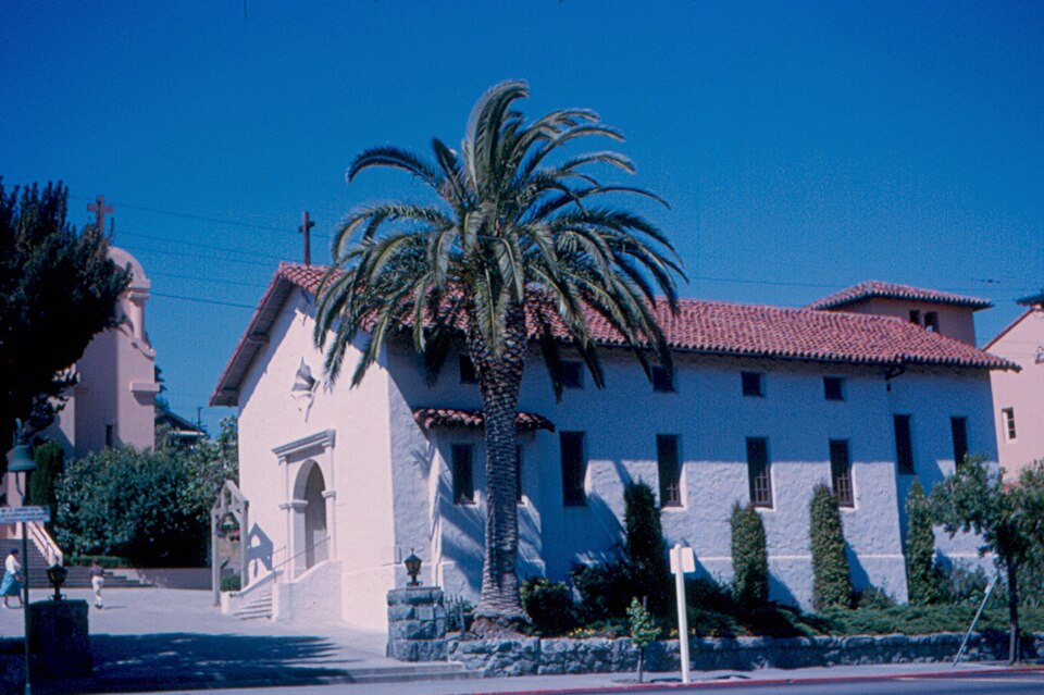 1963 archival photograph of the reconstructed Mission San Rafael Arcángel chapel in San Rafael, California, with palm tree.