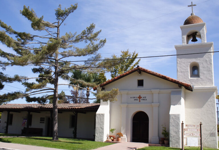 Reconstructed historic Mission Santa Cruz chapel with bell tower and white entrance in Santa Cruz, California