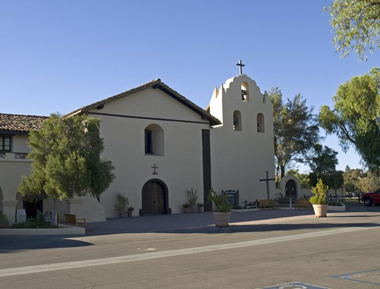 2015 exterior photograph of Mission Santa Inés church and bell tower in Solvang, Santa Barbara County.