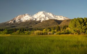 Mount Shasta above northern California forest; illustrative landscape, not a current route conditions photograph