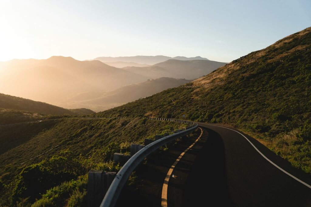Illustrative winding mountain road, not a live Lake Hughes road condition