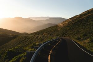 Illustrative winding mountain road, not a live Lake Hughes road condition