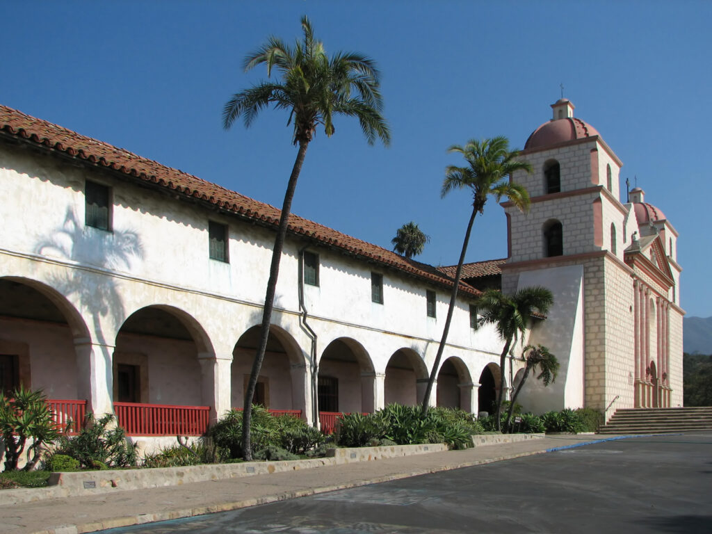 Historic Old Mission Santa Barbara with its two bell towers, arcades and palm trees in Santa Barbara, California
