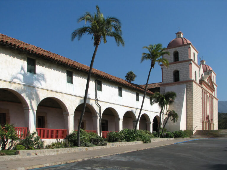 Historic Old Mission Santa Barbara with its two bell towers, arcades and palm trees in Santa Barbara, California