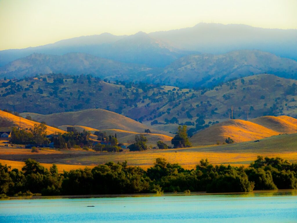 Illustrative reservoir landscape by Donna Elliot / Unsplash, not an October 2026 California reservoir measurement.