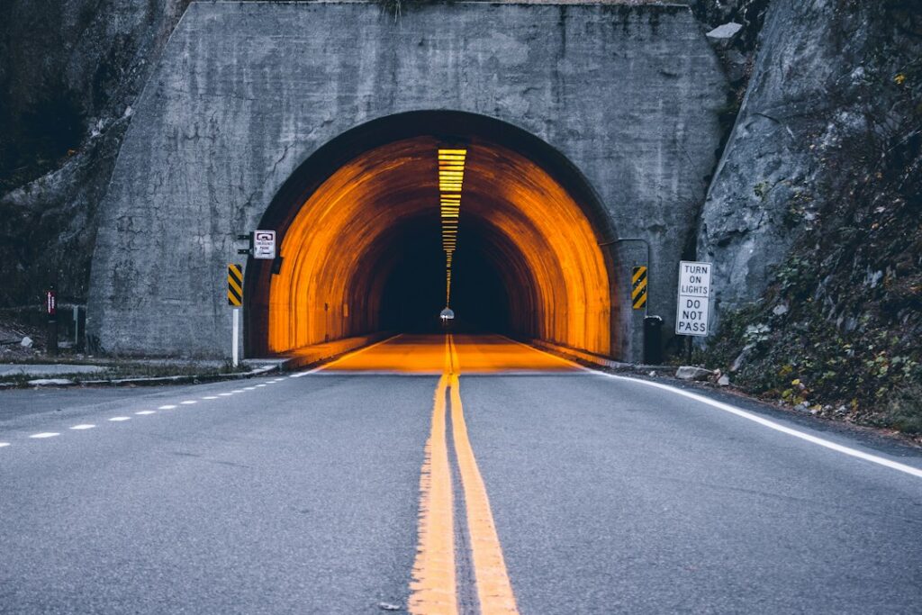 Illustrative tunnel interior by Daniel Jerez / Unsplash; not Caldecott Tunnel or the scheduled October 26–28 maintenance work.