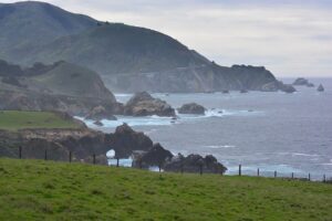 Rocky Creek Bridge and coastal natural arch seen from Notleys Landing Vista Point, photographed March 2025