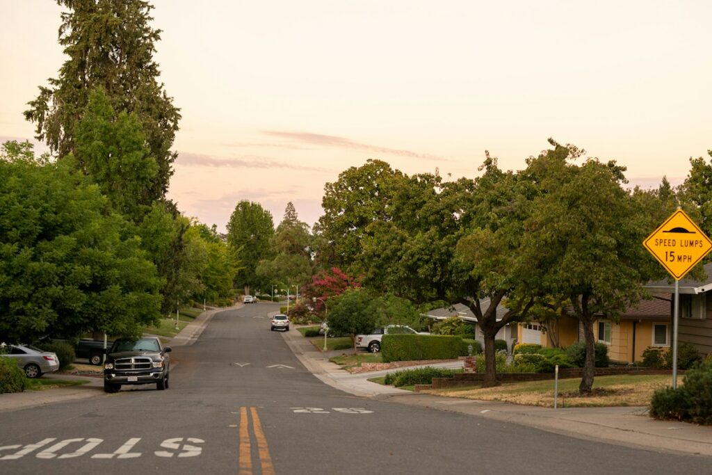 Houses along a street in Sacramento, California, photographed by Michael Kahn / Unsplash. Illustrative only; does not identify a parcel receiving tax relief.