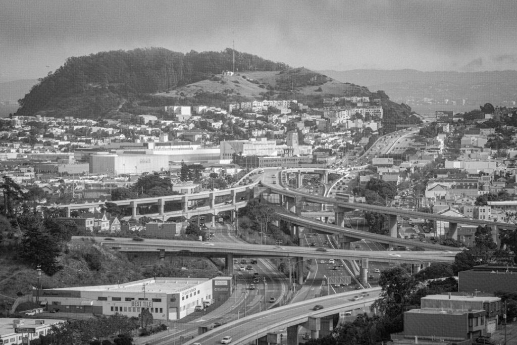 Illustrative elevated freeway interchange and traffic in San Francisco. Photograph: David Yao / Unsplash. Not the US-101 Hospital Curve closure on October 18, 2026.