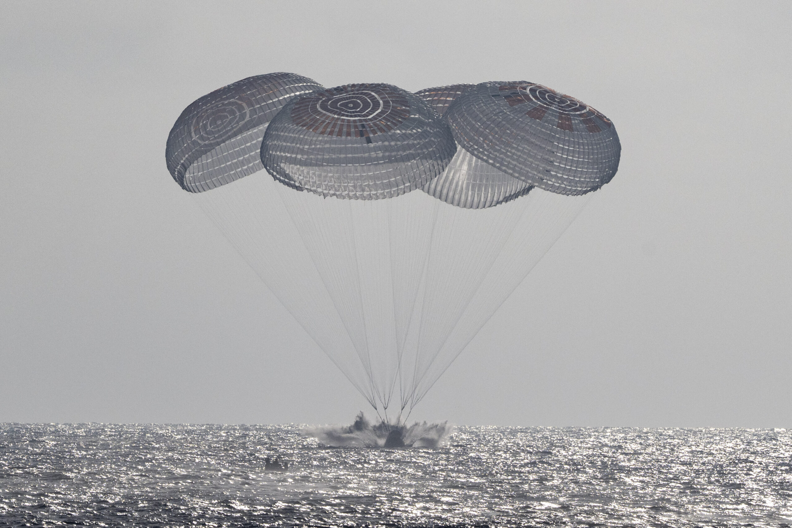 SpaceX Crew Dragon Freedom floating in the Pacific Ocean after Crew-12 splashdown off Los Angeles