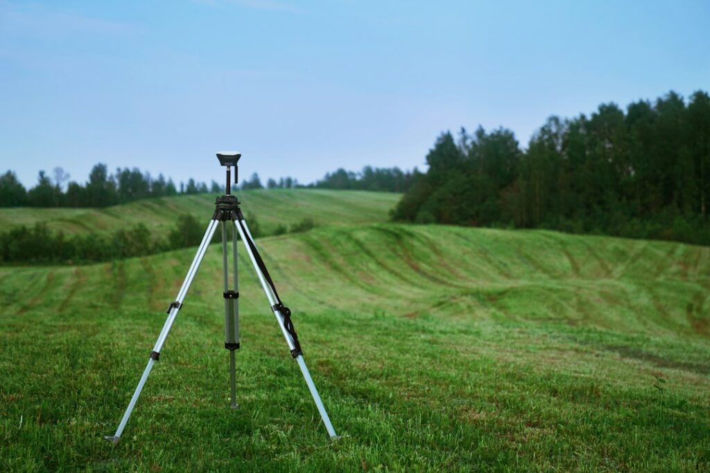 Illustrative field surveying instrument by Valerie V / Unsplash; not a boundary survey of any particular California property.