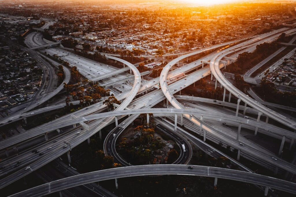 Illustrative aerial urban highway image by Denys Nevozhai / Unsplash; not actual California SR-91 roadwork.